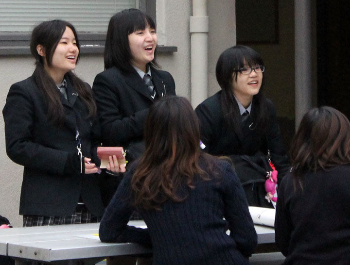 Students from Oki Gaukin High School in Japan socialize at lunch.