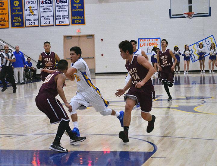 Christian Mora takes the ball to the hoop.