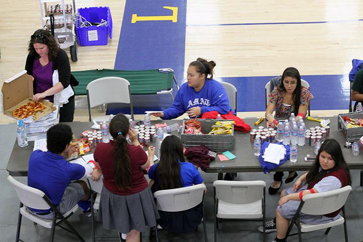 Bishop Amat students gather around a snack table to replace fluids, and prevent post-donation dizziness. 