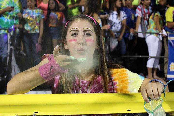 Ashley Villavicencio blows baby powder in the Dawg Pound during Bishop Amat's 63-28 victory over Chino Hills.
