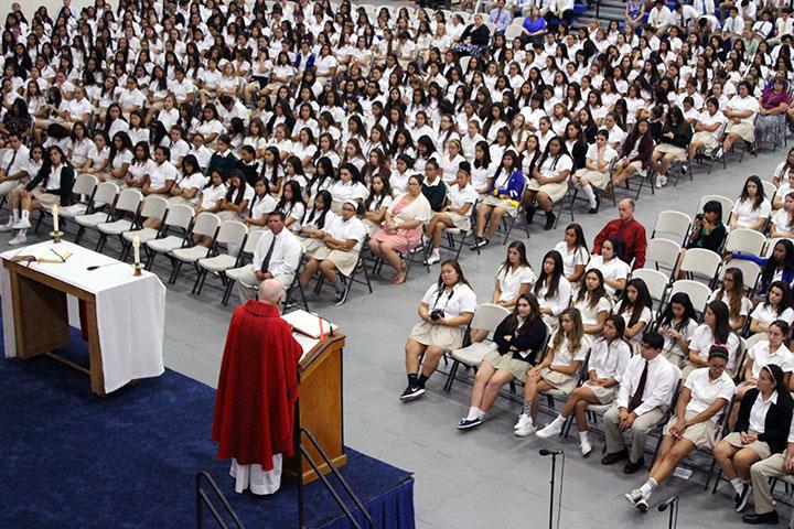 Monsignor+Carroll+reads+the+Liturgy+to+the+Amat+student+body.+