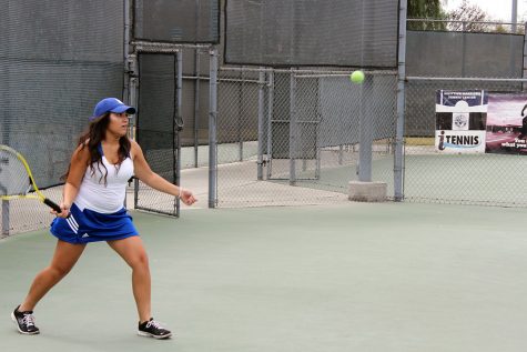 Lancers warm up before Tennis match against La Salle 