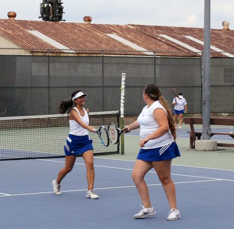 Jade Go and Kristie Jimenez win a set in girls doubles
