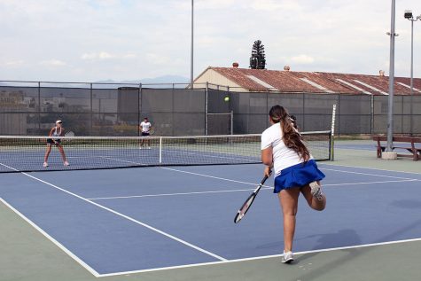 Kristie Jimenez serving
