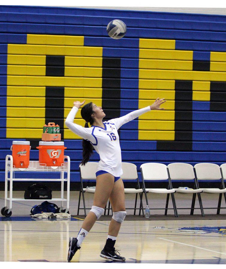 No. 16 Analisa Razo serves the ball.