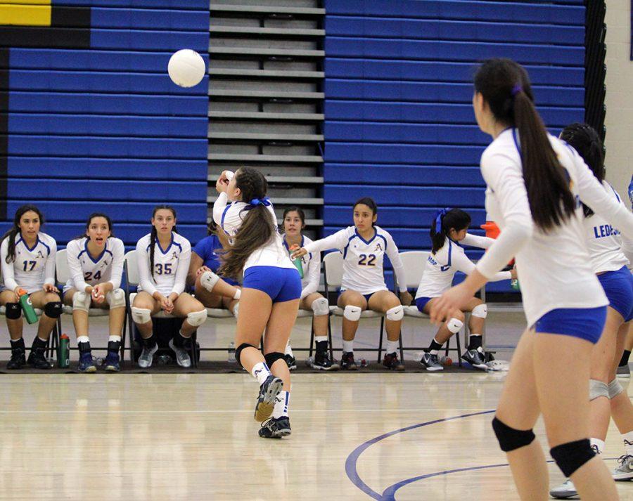 No. 2 Lily Hernandez dives to dig the ball.