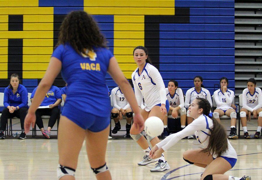 No. 2 Lily Hernandez digs a ball. 