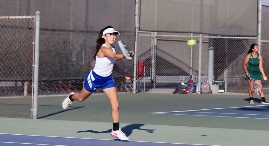 Iliana Herrera hitting the ball back. 