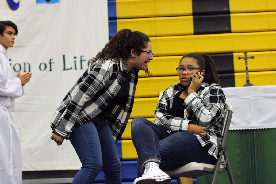 Faith in Action students Priscilla Pimentel and Noelle Malooly  act out a skit about the importance of family. 