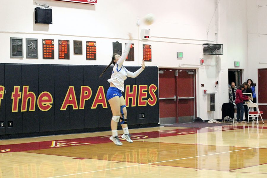 Camille serves the ball to get an ace.