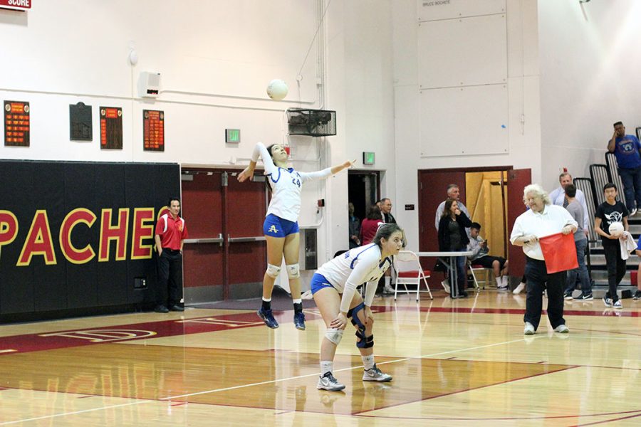 Lindsey Lane serving the ball to Arcadia.