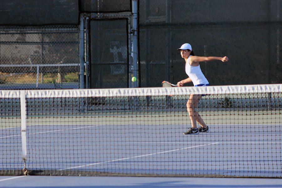 Alexis Nebrensky returns the forehand.