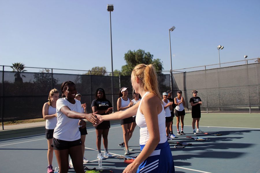 No.1 singles Natalie Lodolo meets her opponent.