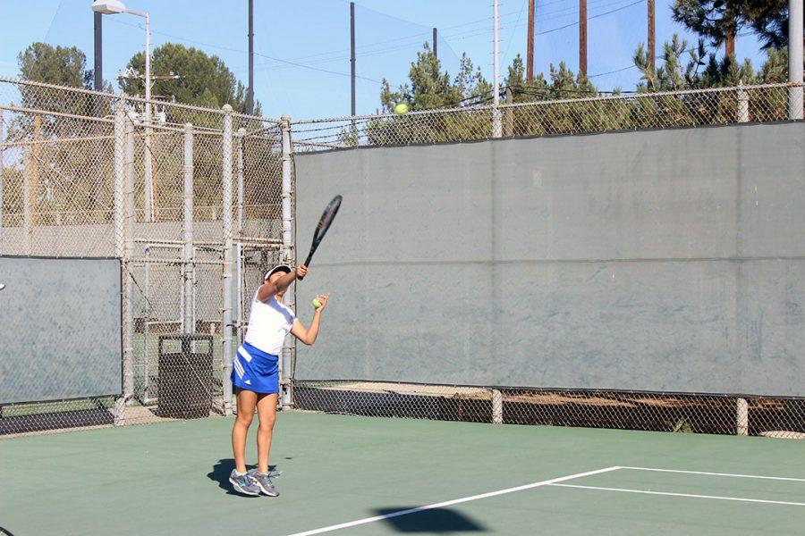 Maiya Franco serves the ball.