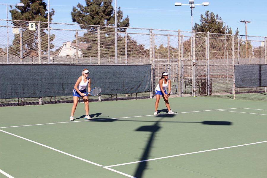 Singles players Natalie Lodolo and Kalea Fajardo warming up.