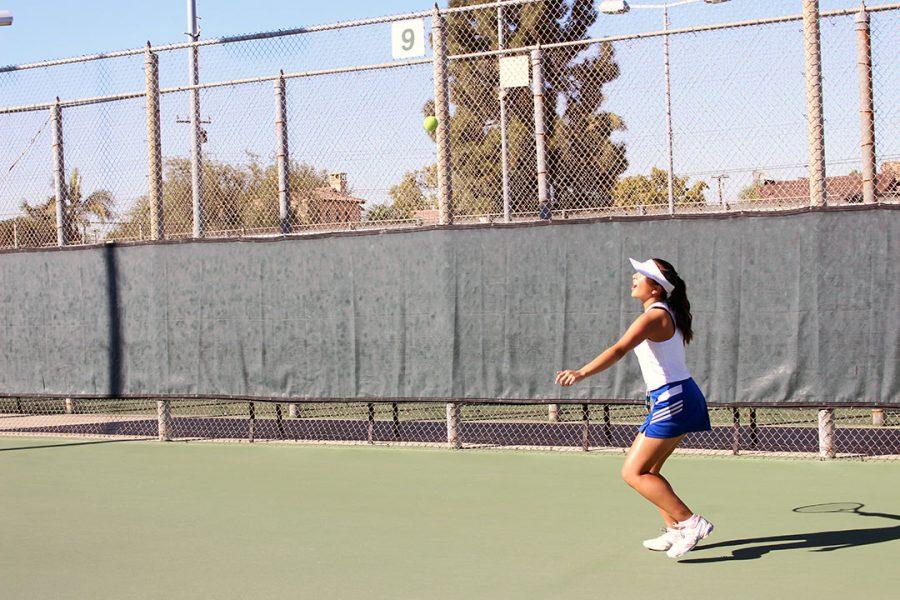 Jade Go prepares to return the forehand.