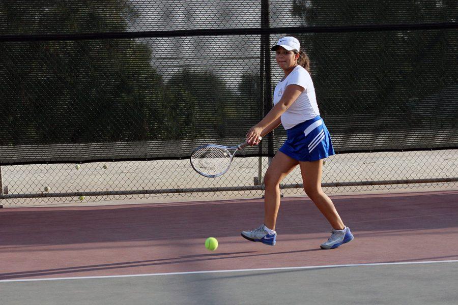 Alex Huizar prepares to return the ball.