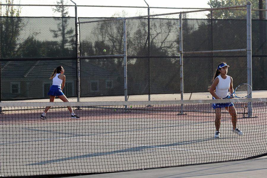 Doubles Partner Galaviz returning at backhand.