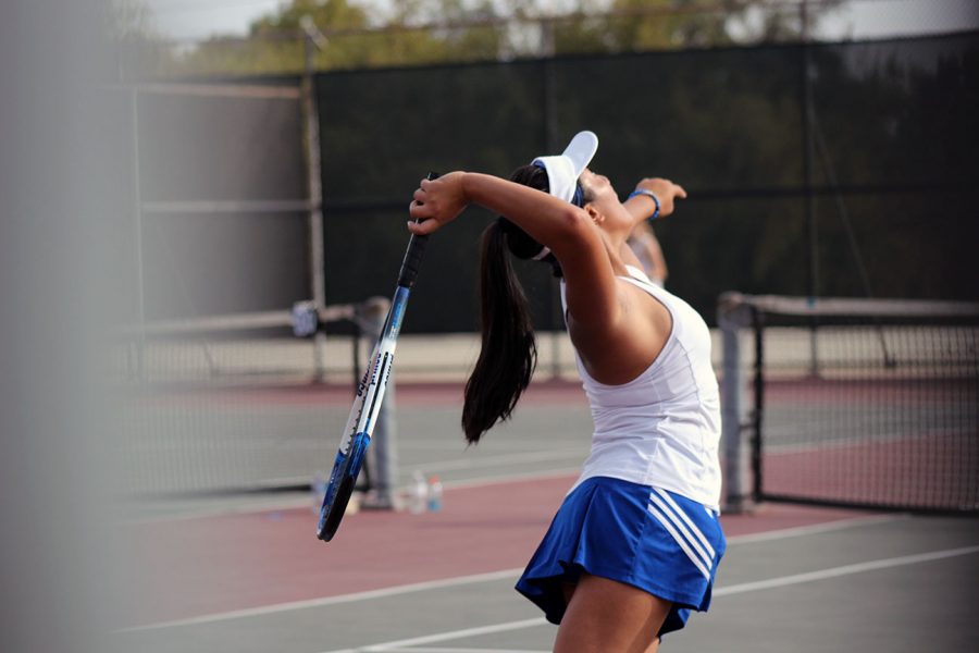 Kalea Fajardo finishes her serve. 