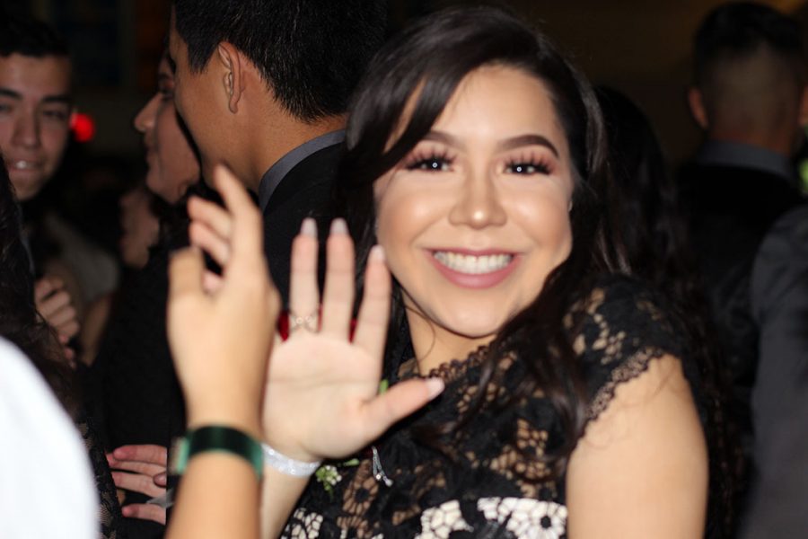 Priscilla Viramontes waving to the camera.