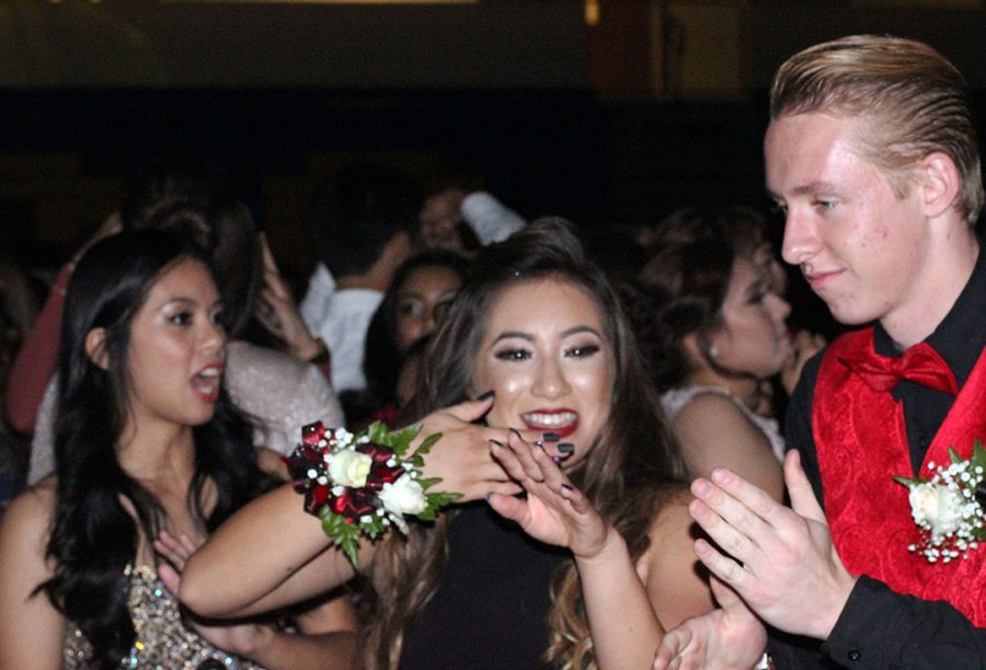 Stephanie Sapien dances with her date Michael Zahn.