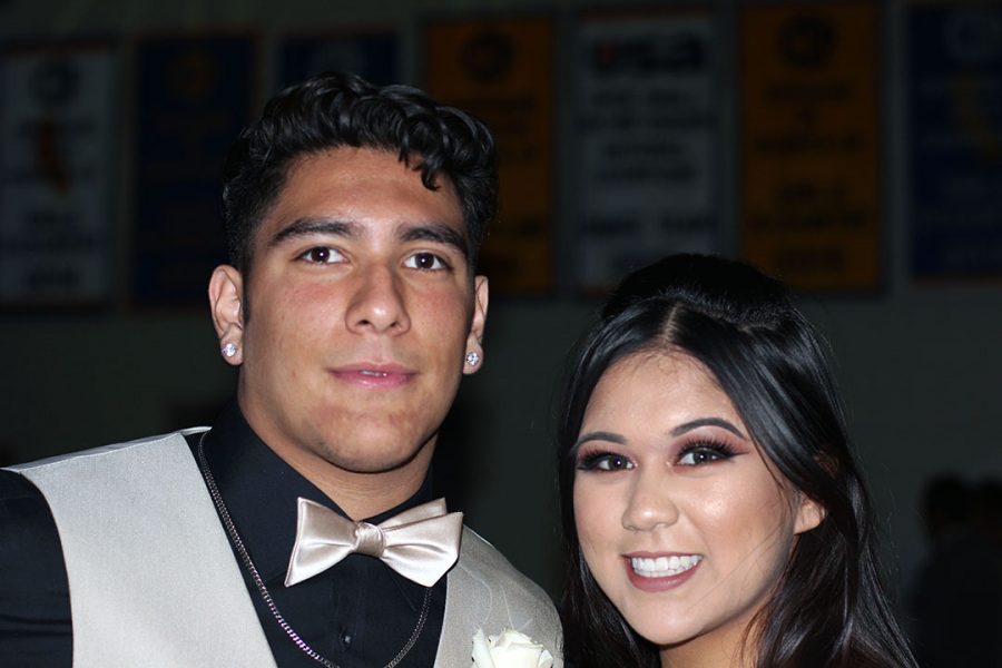 Luke Espinosa and date, Taylor Noriega, smile for the camera.