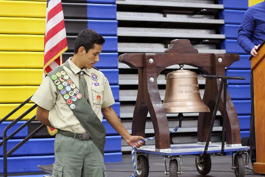 Luis Huerta ringing a bell. 