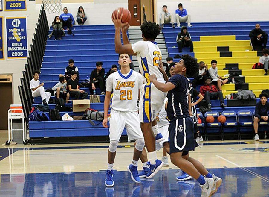 Damian Moore jumps up to catch the rebound.