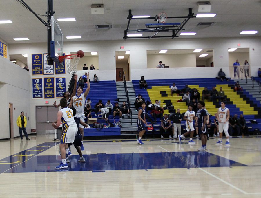 Jonathan Aguirre jumps up to tip the ball into the net.