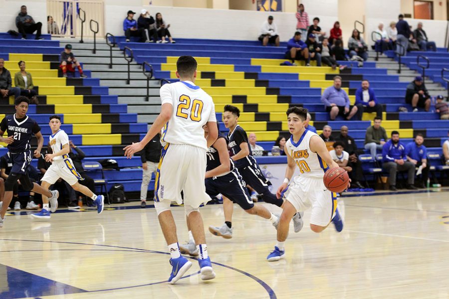 Vincent Rodriguez dribbles the ball up the court.