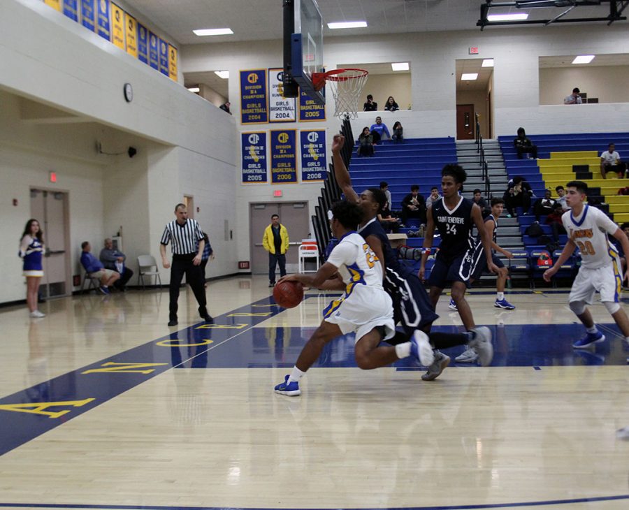 Damian Moore goes to the hoop.