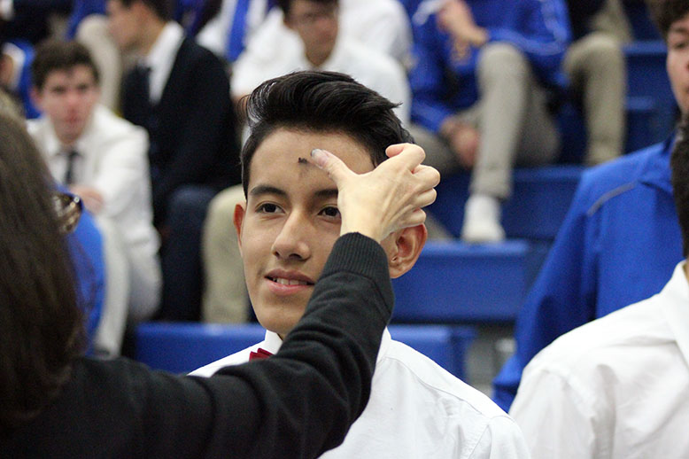 A student receiving ashes. 