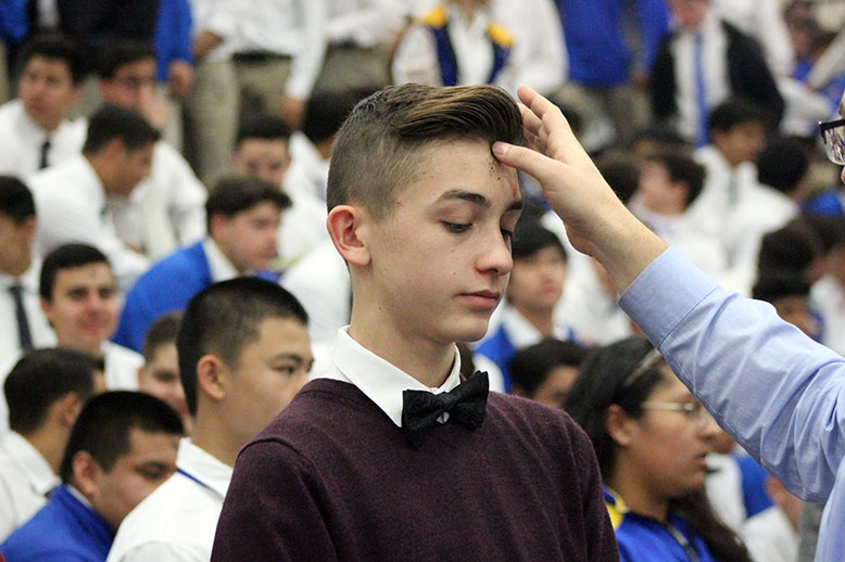 A student receiving ashes. 