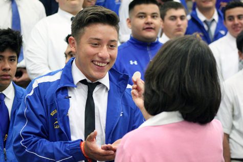 A student receives the Eucharist.