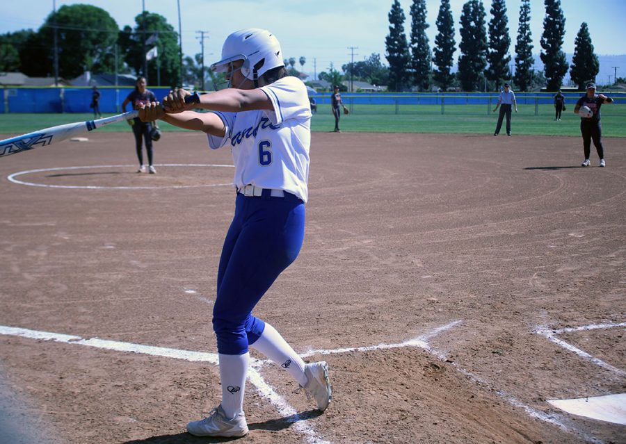 Sophomore Jadeyn Juarez practices a few swings before batting. 