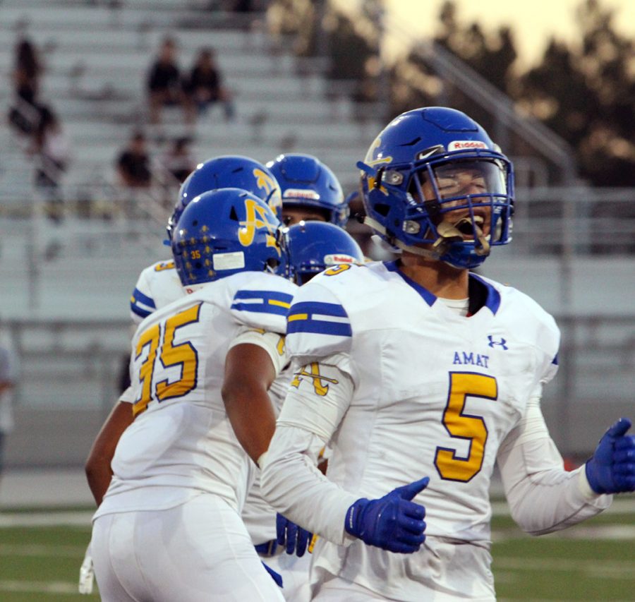 Mason Montanez celebrating after a successful play.