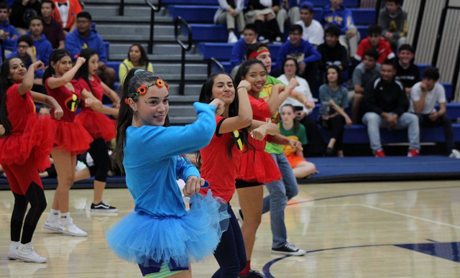Freshman Caydence Hartman representing her class on the gym floor. 