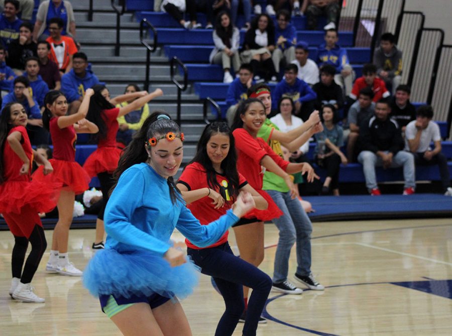 Dance Team members Caydence Hartman and Jackie Renteria feeling the beat on the dance floor. 