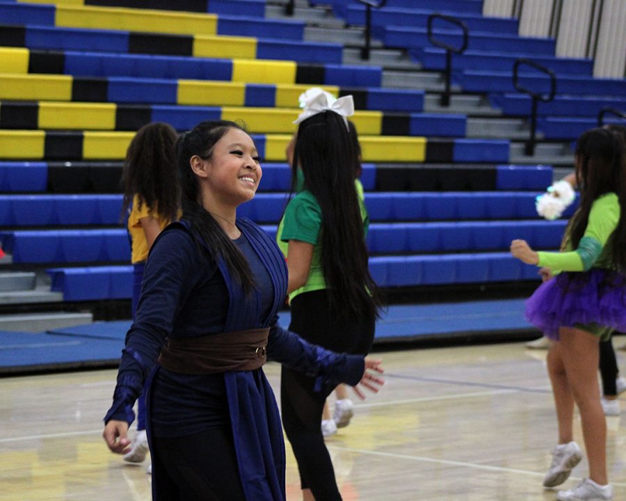 Junior Karina Padilla performs with the cheer team at the Pep Week 2018 Rally.