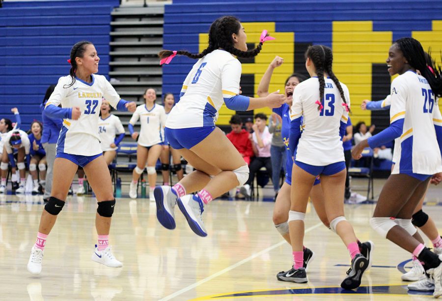 Lady Lancers cheering after an ace!