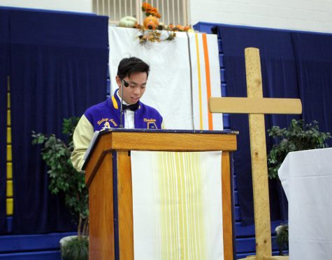 Christian Tran reciting the petitions. 