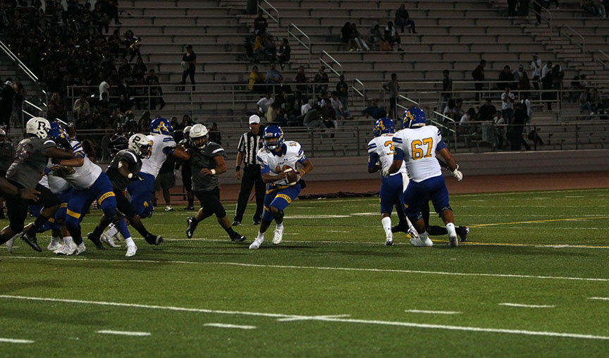 QB Aidan Sanchez looks for an open receiver. 