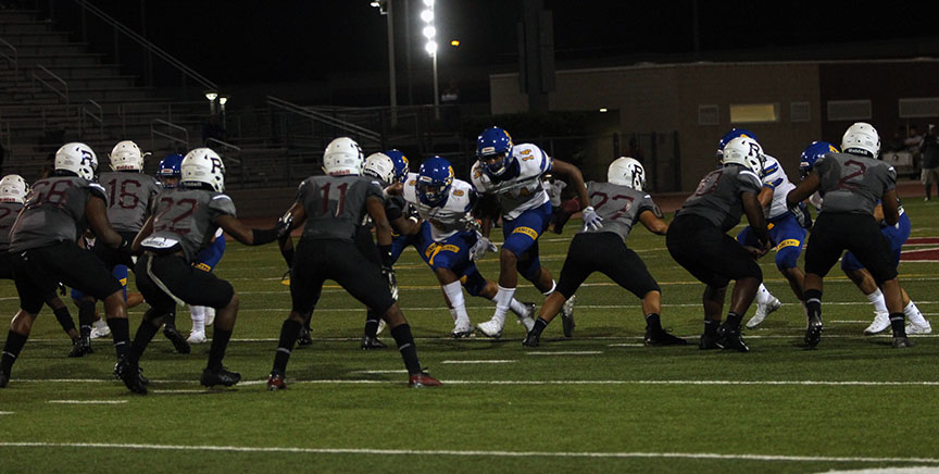 Elijah Ponder tries to block the punt.