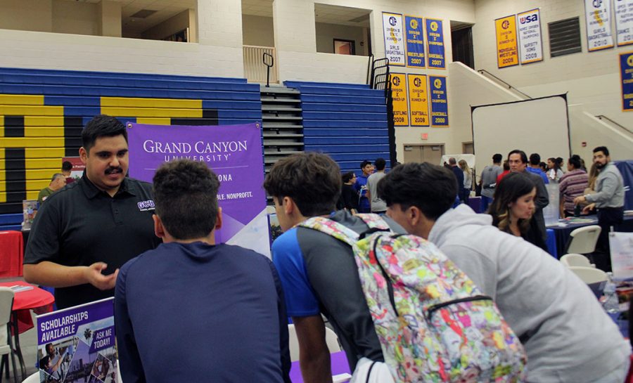 Seniors, Mark Hubert, Michael Landeros. and Cris Gastelon are intrigued by Grand Canyon University's aspects. 