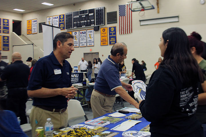 UC Davis adviser explaining school works to on of our students. 