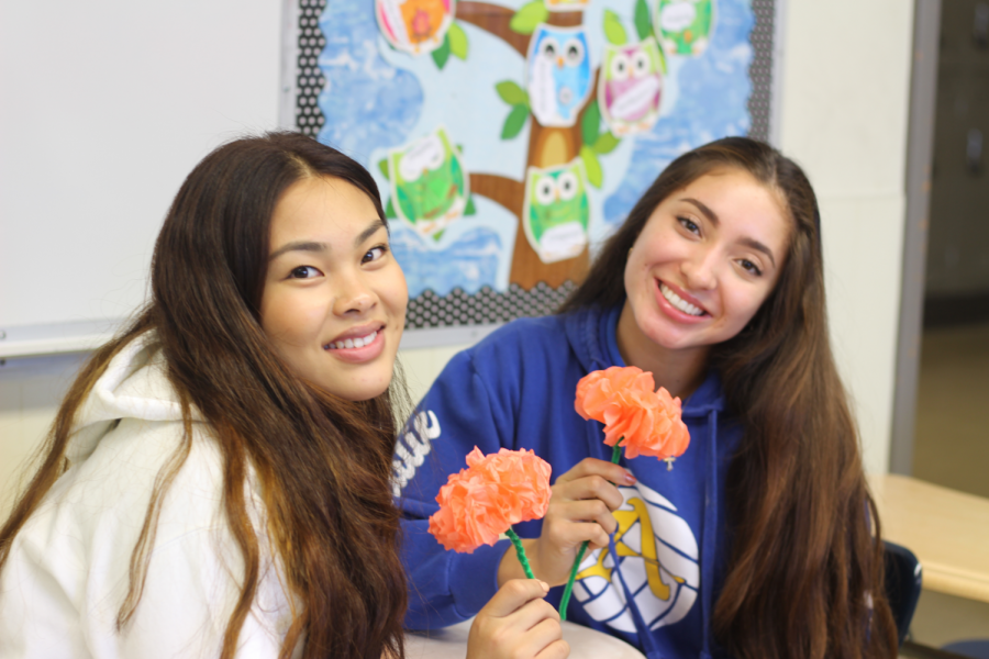 IB Spanish students making paper flowers.