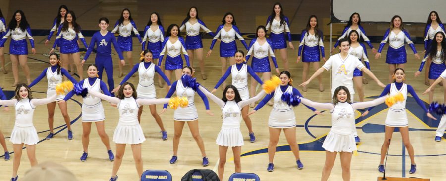 The cheer and dance team is showing some future lancers some of their work .