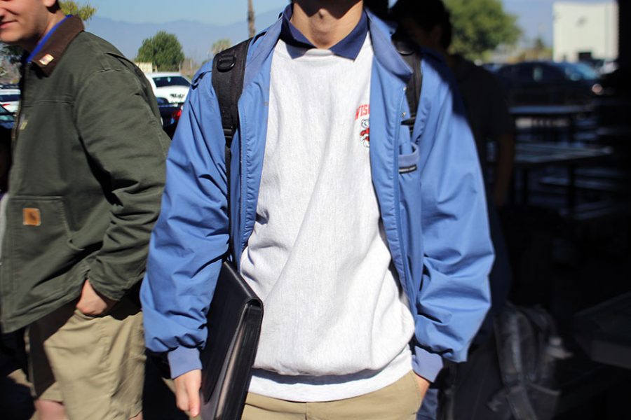 An unidentified student would be in dress code if the sweatshirt under was an Amat one. 