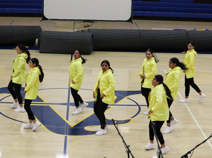 The hip-hop dance team is showing off some dance moves for Amat's visitors. 
