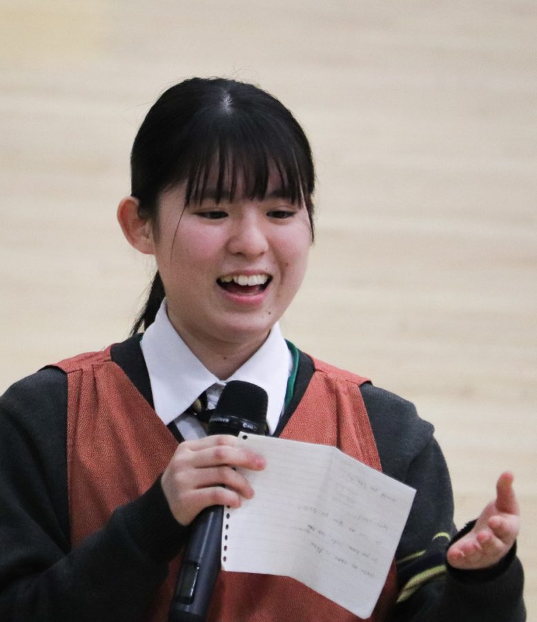 One of the visitors students is picking someone to make Japanese tea with. 